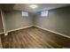 Neutral bedroom with vinyl plank flooring, good light, and white trim. and neutral paint scheme at 6139 S Adams Dr, Centennial, CO 80121