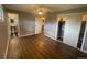 Bedroom with hardwood floors features a closet and an adjacent bathroom at 6139 S Adams Dr, Centennial, CO 80121