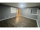 Neutral bedroom with vinyl plank floors, good light, and built in shelving, and neutral paint scheme at 6139 S Adams Dr, Centennial, CO 80121