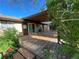 Covered deck with sliding glass doors provides a seamless transition to the backyard at 6139 S Adams Dr, Centennial, CO 80121