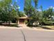 Charming single-story home with a driveway, mature trees, and a well-maintained lawn at 6139 S Adams Dr, Centennial, CO 80121