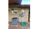 Home exterior featuring brick facade, air conditioning unit, and outdoor utilities on back deck at 6139 S Adams Dr, Centennial, CO 80121