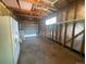 Spacious garage featuring exposed framing, shelving, and ample room for storage and parking at 6139 S Adams Dr, Centennial, CO 80121