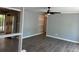 Bright living room features laminate floors, gray walls, and a modern ceiling fan at 6139 S Adams Dr, Centennial, CO 80121