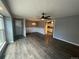 The open concept living area features hard surface floors, ceiling fan and chandelier at 6139 S Adams Dr, Centennial, CO 80121