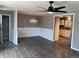 Open-concept living and dining area features stylish lighting and laminate floors at 6139 S Adams Dr, Centennial, CO 80121