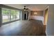 Inviting living room featuring a large window and updated laminate flooring at 6139 S Adams Dr, Centennial, CO 80121