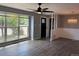 Inviting living room featuring a large window and updated laminate flooring at 6139 S Adams Dr, Centennial, CO 80121