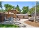 Backyard with a pergola over brick patio with outdoor furniture at 321 S Emerson St, Denver, CO 80209