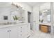 Bright bathroom features a double vanity, modern fixtures, and a separate makeup area at 321 S Emerson St, Denver, CO 80209