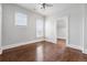 A bright, empty bedroom with hardwood floors and multiple windows at 321 S Emerson St, Denver, CO 80209