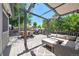 Inviting deck features stylish outdoor furniture, dining area, and a charming pergola with string lights at 321 S Emerson St, Denver, CO 80209