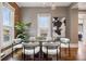 Bright dining room with a glass-top table and stylish upholstered chairs at 321 S Emerson St, Denver, CO 80209