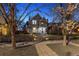 Charming two-story home with a welcoming entrance and a well-lit pathway at twilight at 321 S Emerson St, Denver, CO 80209