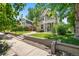 Well-maintained two-story home with a green lawn and inviting front entrance at 321 S Emerson St, Denver, CO 80209
