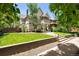 Beautiful two-story home with well-manicured lawn, mature trees, and covered porch at 321 S Emerson St, Denver, CO 80209