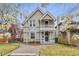 Charming two-story home with a well-manicured front yard and inviting entrance at 321 S Emerson St, Denver, CO 80209
