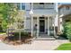 Charming front porch with seating and decorative plants creates a welcoming entrance to the home at 321 S Emerson St, Denver, CO 80209