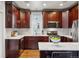 Modern kitchen boasts stainless steel appliances, marble countertops, and custom cabinetry at 321 S Emerson St, Denver, CO 80209