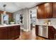 View from kitchen into living areas with stainless steel appliances and marble countertops at 321 S Emerson St, Denver, CO 80209