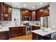 Beautiful kitchen with stainless steel appliances, marble countertops, and custom cabinetry at 321 S Emerson St, Denver, CO 80209