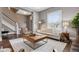 Inviting living room with hardwood floors and an elegant staircase at 321 S Emerson St, Denver, CO 80209