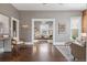 Spacious living area with hardwood floors, neutral tones, and seamless flow to other rooms at 321 S Emerson St, Denver, CO 80209
