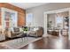 Relaxing living room features a brick wall, comfortable seating, and hardwood floors at 321 S Emerson St, Denver, CO 80209