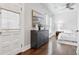 Light-filled main bedroom boasts hardwood floors and a view of the outdoors at 321 S Emerson St, Denver, CO 80209