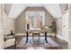 Home office with hardwood floors, large window, and ample natural light at 321 S Emerson St, Denver, CO 80209