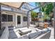 Inviting patio with comfortable seating, wooden table, and string lights for outdoor relaxation at 321 S Emerson St, Denver, CO 80209