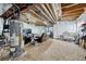 Unfinished basement area with exposed ceiling, water heater, and ample space at 23413 E Dorado Pl # A, Aurora, CO 80016