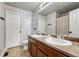 Spacious bathroom featuring double vanity sinks, tile flooring, and plenty of storage at 23413 E Dorado Pl # A, Aurora, CO 80016
