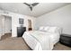 Cozy bedroom with neutral walls, plush carpet, and direct access to the bathroom at 23413 E Dorado Pl # A, Aurora, CO 80016