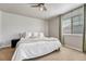 Relaxing bedroom featuring carpet floors, a ceiling fan, and large windows for optimal light at 23413 E Dorado Pl # A, Aurora, CO 80016