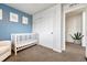 Bedroom with white furniture, a crib, and a closet with sliding doors at 23413 E Dorado Pl # A, Aurora, CO 80016