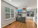 Cozy dining area with wood floors, gray cabinet, and natural light from windows at 23413 E Dorado Pl # A, Aurora, CO 80016
