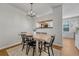 Cozy dining room with modern lighting and a view into the kitchen area at 23413 E Dorado Pl # A, Aurora, CO 80016