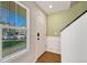 Bright entryway featuring hardwood floors, a white front door, and natural light at 23413 E Dorado Pl # A, Aurora, CO 80016