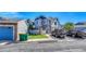 Townhome complex showcasing well-maintained landscaping and assigned parking spaces at 23413 E Dorado Pl # A, Aurora, CO 80016