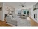 Spacious living room featuring a large sectional sofa, modern ceiling fan, and lots of natural light at 23413 E Dorado Pl # A, Aurora, CO 80016