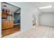 Bright dining room with tile flooring and seamless transition to open concept kitchen at 3921 S Acoma St, Englewood, CO 80110