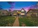 Charming home featuring a well-kept lawn, inviting pathway and a cozy covered front porch at 3921 S Acoma St, Englewood, CO 80110