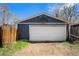 Detached garage with a basketball hoop and white garage door at 3921 S Acoma St, Englewood, CO 80110