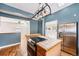 Bright kitchen with tile countertops, stainless appliances and a gas range at 3921 S Acoma St, Englewood, CO 80110