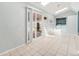 Bright laundry room with skylights, tile flooring, and modern washer and dryer at 3921 S Acoma St, Englewood, CO 80110