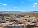 Stunning aerial view of the city featuring the stadium and a picturesque mountain range in the distance at 891 14Th St # 3204, Denver, CO 80202