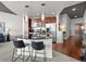 Modern kitchen with stainless appliances, dark wood cabinets, and sleek countertops at 891 14Th St # 3204, Denver, CO 80202
