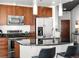 Modern kitchen features stainless steel appliances, sleek black countertops, and stylish pendant lighting at 891 14Th St # 3204, Denver, CO 80202
