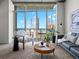 Inviting living room filled with natural light from large windows offering panoramic city views at 891 14Th St # 3204, Denver, CO 80202